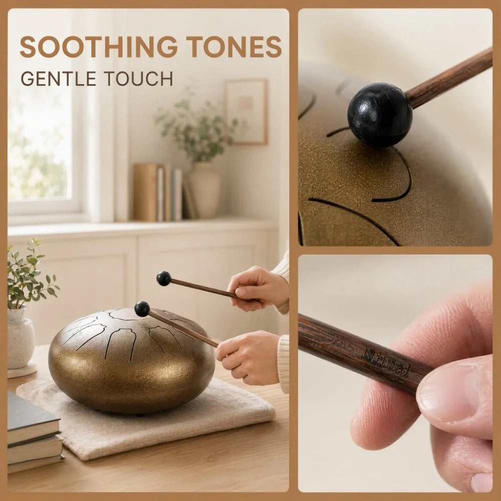 Close-up of a handpan drum mallet with a wooden handle and black silicone tip resting on a golden-colored drum surface.
