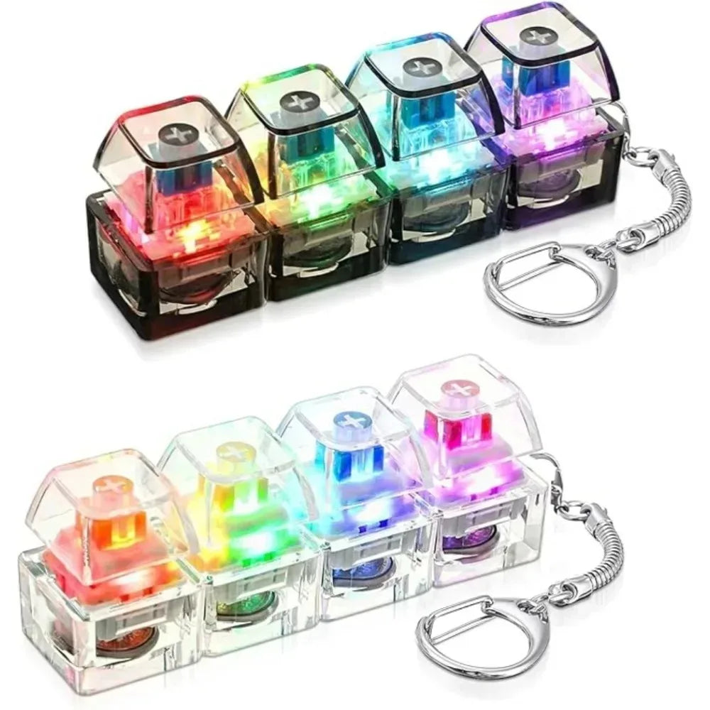 A set of colorful keyboard keychain fidget toys with LED lights attached to a silver keyring.