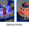 A toy marine rescue boat with lights and a red cabin, shown in two views.