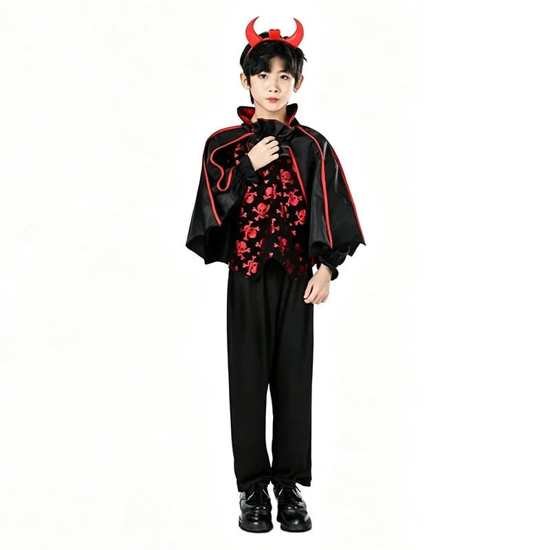 A young person wearing a black vampire bat costume set with a cape and accessories.