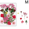 A collection of pressed natural dried flowers in shades of pink, red, and green for resin art and jewelry making.