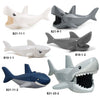 A collection of gray and white marine animal building blocks including sharks, whales, and octopuses.