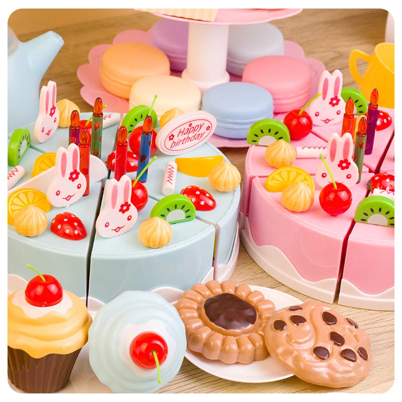 A colorful DIY pretend play birthday cake tea set featuring pink and purple cakes, fruit, and decorative elements.