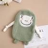 A soft, light green plush toy shaped like a frog with a white face and pink accents.