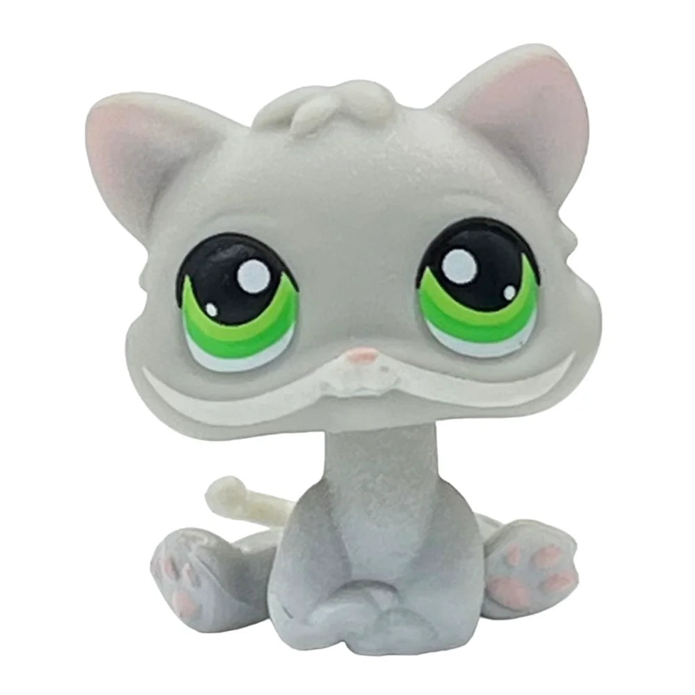 A cute gray cat bobble head figurine with large green eyes and pink accents.