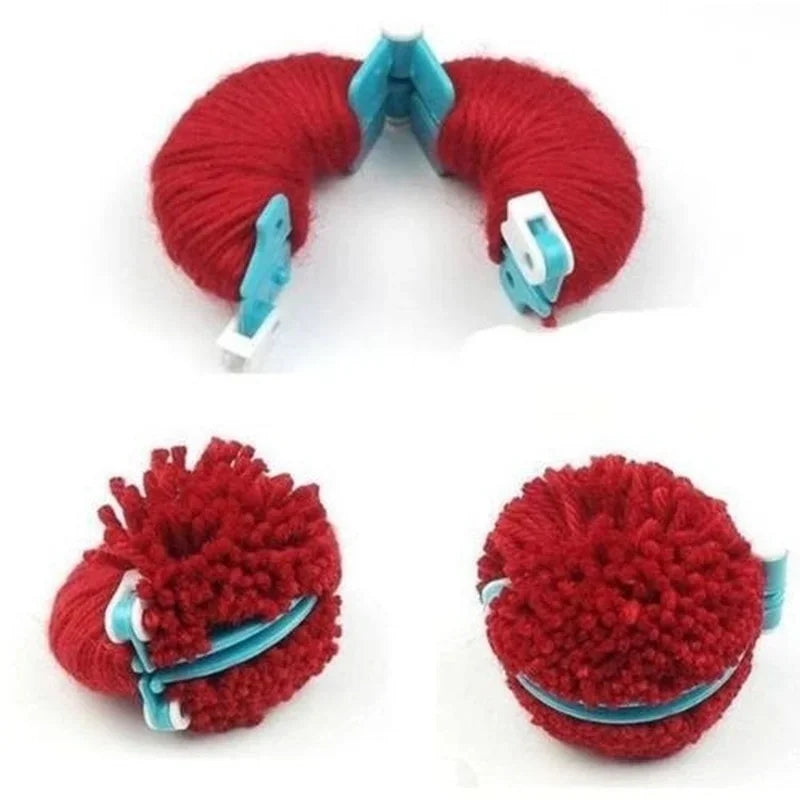 A set of red yarn pom pom makers and knitting tools for DIY craft projects