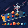 A wooden solar system puzzle featuring eight planets, including the sun, arranged on a dark blue background.