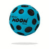 A bright blue foam ball with black polka dots, the Original Moon Ball.