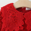 Red lace knit sweater for a toddler girl featuring a doll collar detail.