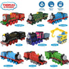 A collection of Thomas & Friends diecast train characters including engines like Gordon, Emily, and Edward.