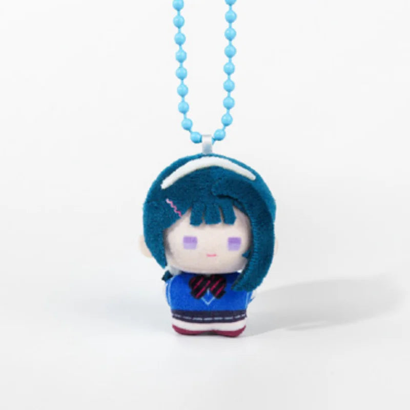 A small plush charm of an anime character with blue hair and purple eyes hanging from a light blue beaded necklace.