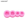 A set of five pink silicone molds shaped like roses and peonies for resin, jewelry, and baking.