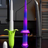 A purple and green 3D gravity banana katana stress relief toy is displayed next to a black knife.