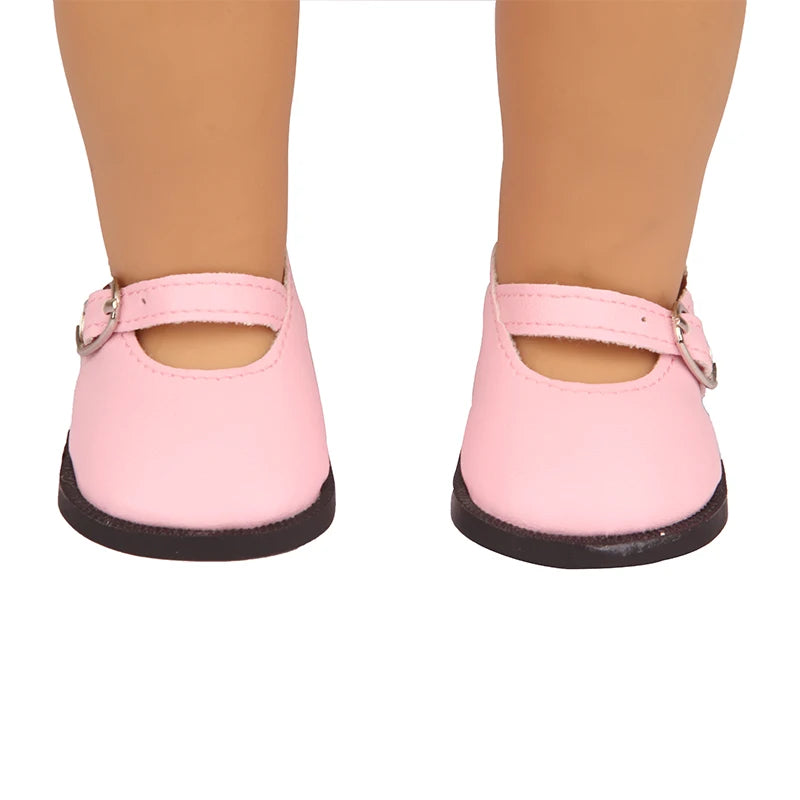 Pink unicorn skirt outfit for an 18-inch doll shown on a person's leg.