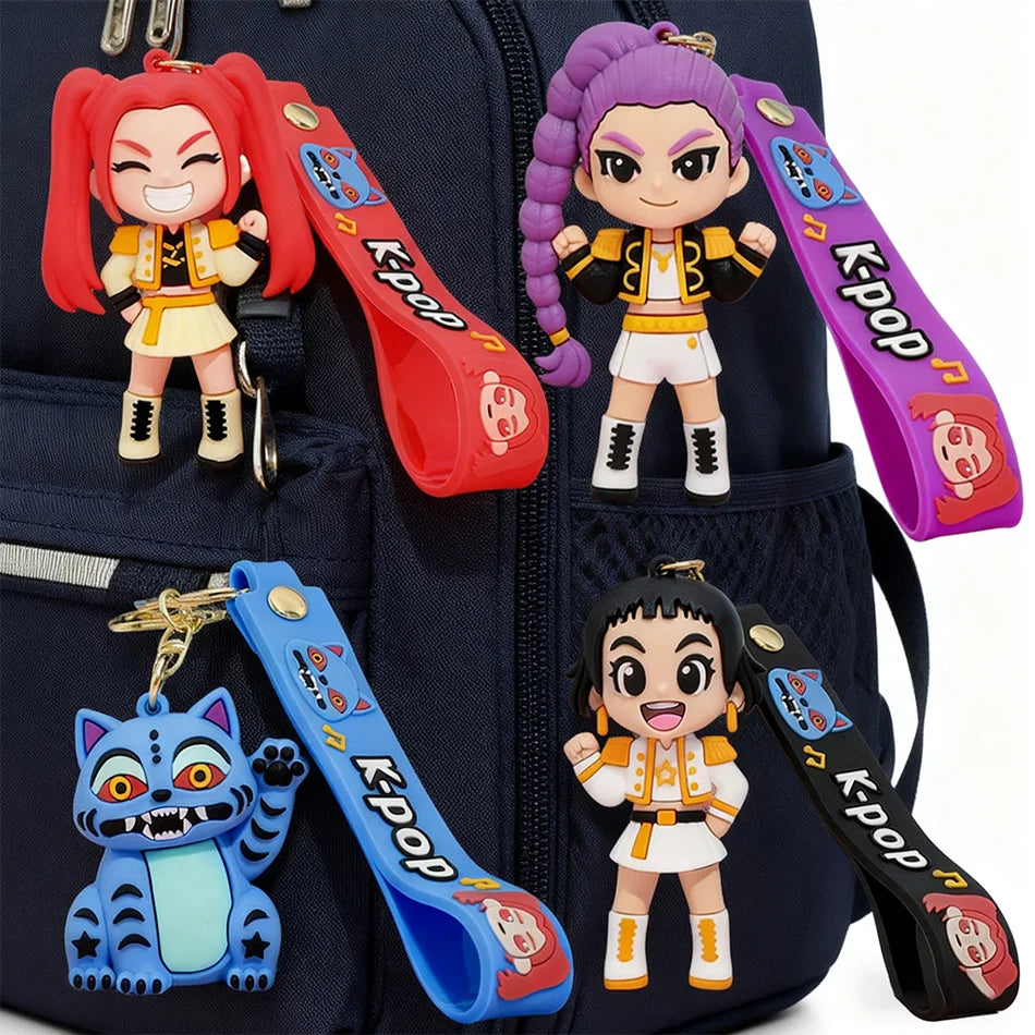 A dark blue backpack featuring several Keypop anime collectible dolls and keychains.