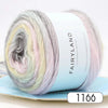A spool of gradient rainbow yarn in various pastel shades is shown rolled up on a light blue label.