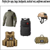 A collection of tactical gear including a military-style shirt, a black backpack, and various hook-and-loop patches.
