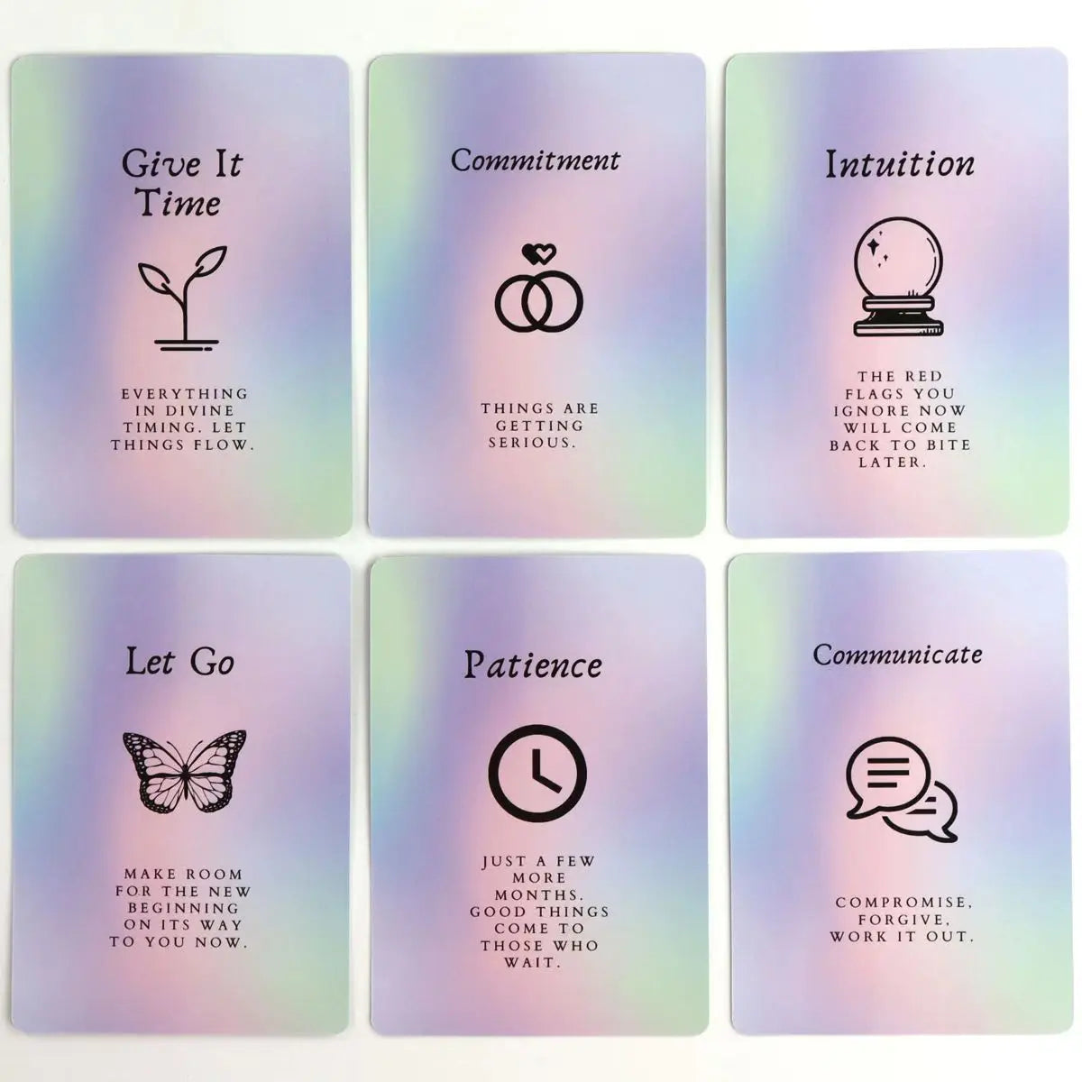 A set of six purple and green cards from an oracle deck featuring titles like Give It Time, Commitment, Intuition, Let Go, Pa