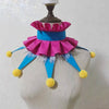 Handmade colorful clown ruff collar featuring pink and blue ruffles and yellow pom-poms