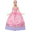 A female doll wearing a pink and purple floral evening gown with sheer overlays.