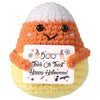 Handmade knitted bat doll in orange and yellow yarn with a gift card tag