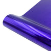 Purple holographic heat transfer vinyl rolled up, showing a shiny iridescent texture.