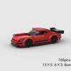 A red classic rally car building block set with black accents and a spoiler.