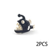 A black plastic ocean animal building block featuring a white snout and ear, with a small protrusion on top.