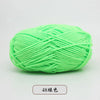 A ball of bright lime green pre-dyed milk cotton yarn for knitting and crochet.