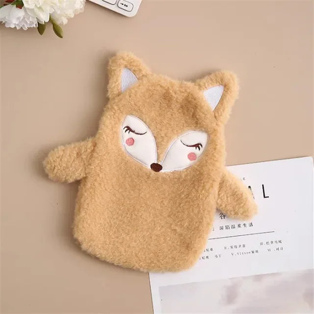 A fluffy, light brown plush toy shaped like a fox head is shown on a beige background.