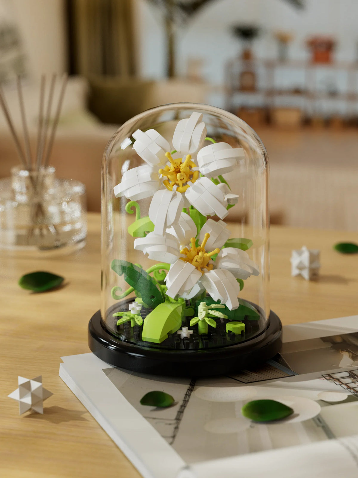 A glass dome display of a white eternal rose flower kit featuring green foliage and yellow centers.