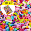 A close-up view of a large pile of colorful plastic building blocks in various shapes and sizes.