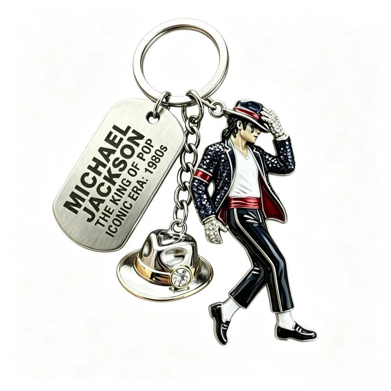A silver keychain featuring a figure of Michael Jackson in a dance pose.