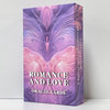 A box of Romance and Love Oracle Cards featuring purple and pink floral designs.