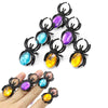 A set of ten Halloween skull and pumpkin fidget toys featuring various colored gemstones like purple, blue, and yellow.
