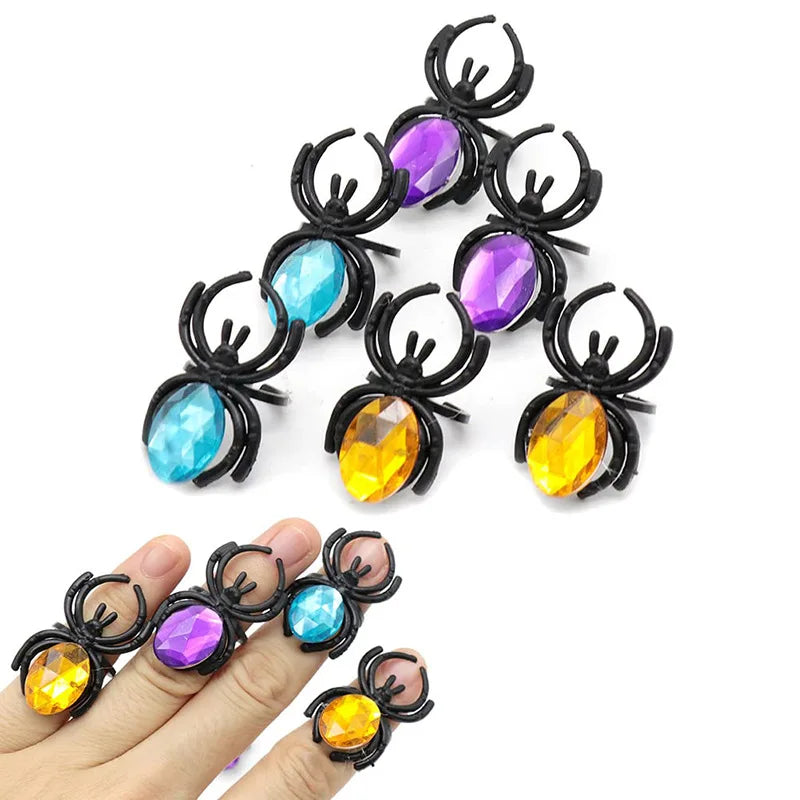 A set of ten Halloween skull and pumpkin fidget toys featuring various colored gemstones like purple, blue, and yellow.