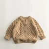 A beige knit cardigan sweater with a textured pattern is shown flat lay.