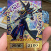 A Yu-Gi-Oh! anime style card featuring a wizard character with a staff and magical effects, displayed in a hand.