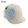 A beige baby cotton baseball cap featuring a blue dinosaur design and cute rabbit ears.