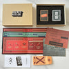 A box set of Secret Hitler card game components including a main box, a tray with two cards, and a sealed card.