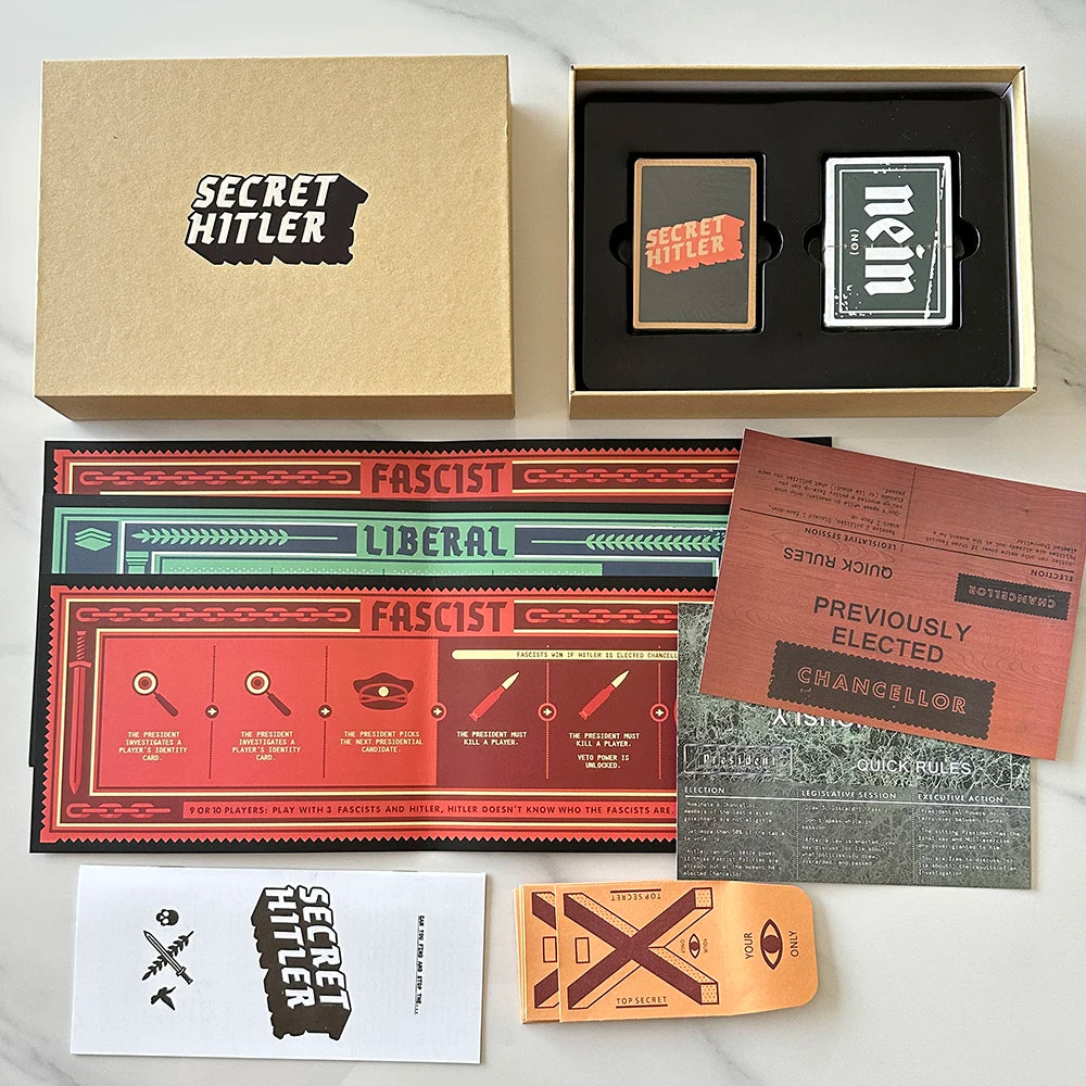 A box set of Secret Hitler card game components including a main box, a tray with two cards, and a sealed card.