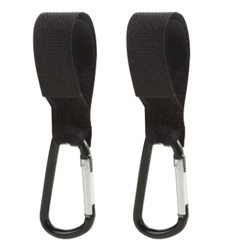 A pair of black aluminum alloy stroller hooks with nylon straps.