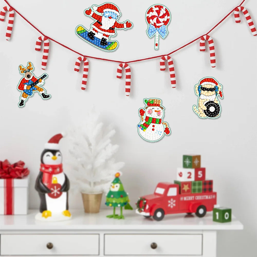 Diamond painting kits featuring Christmas and winter themes, including ornaments and a charm pendant.