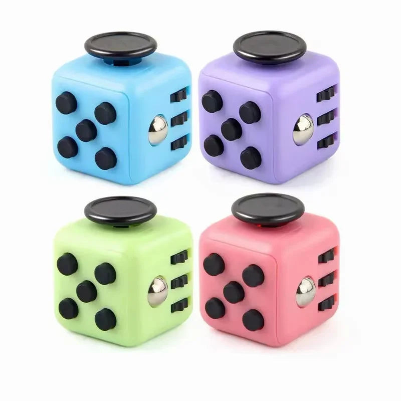 A set of three fidget cubes in blue, purple, and green with magnetic buttons.