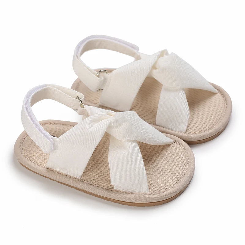 Pair of beige breathable baby first walker sandals with soft anti-slip soles