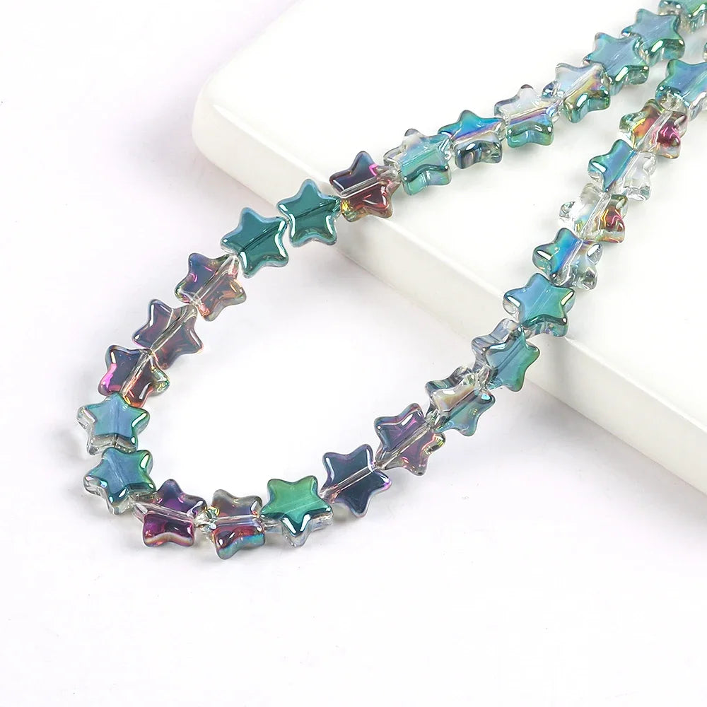 A strand of iridescent, multi-colored glass star spacer beads for jewelry making