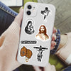 A smartphone displaying a sticker pack featuring religious icons like the Virgin Mary, Jesus, and a crucifixion scene.