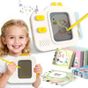 A young girl is holding a white interactive learning board with a yellow pencil, next to several flash cards.