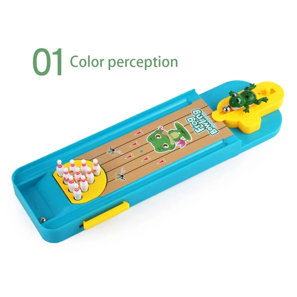 A blue mini frog bowling game set with a wooden lane and yellow bowling pins.