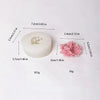 A white silicone mold with a floral design is shown next to its dimensions and weight.